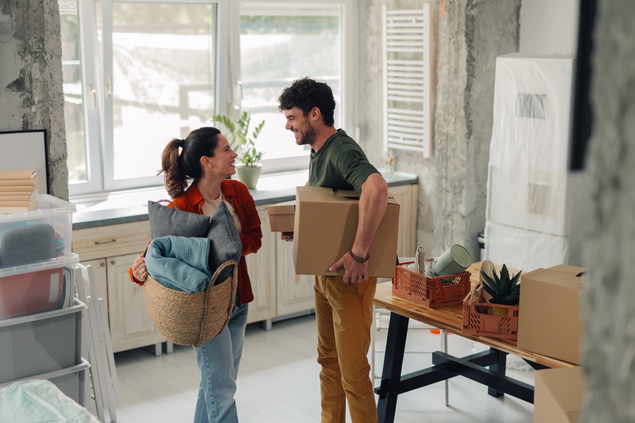 Happy family moving into their new rental home